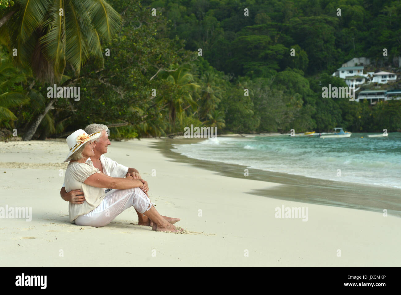 Family relaxing together on beach hi-res stock photography and images ...