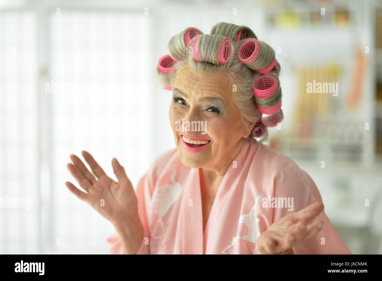 senior woman in bathrobe Stock Photo Alamy
