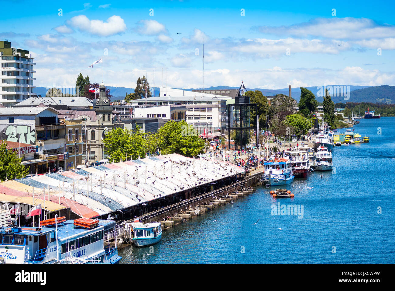 VALDIVIA, CHILE - OCTOBER 30, 2016: Pier and fish market at riverside of Calle-Calle river. This is the main view of Valdivia. Stock Photo