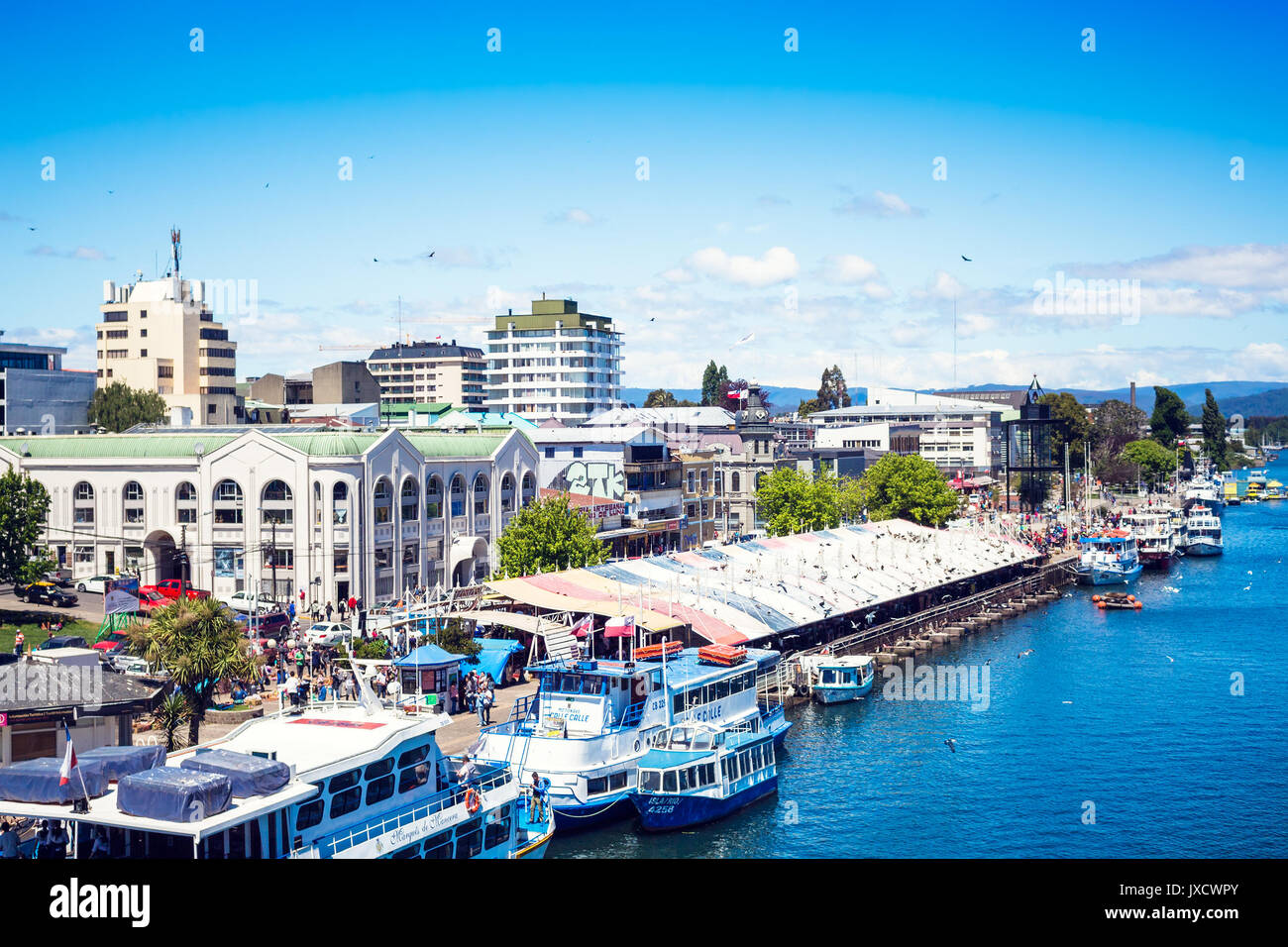 VALDIVIA, CHILE - OCTOBER 30, 2016: Pier and fish market at riverside of Calle-Calle river. This is the main view of Valdivia. Stock Photo