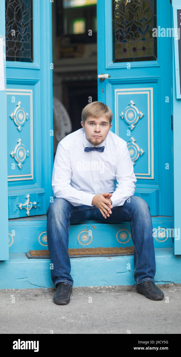 Young Handsome Man With Short Hair Wearing A Bow Tie And Posing In