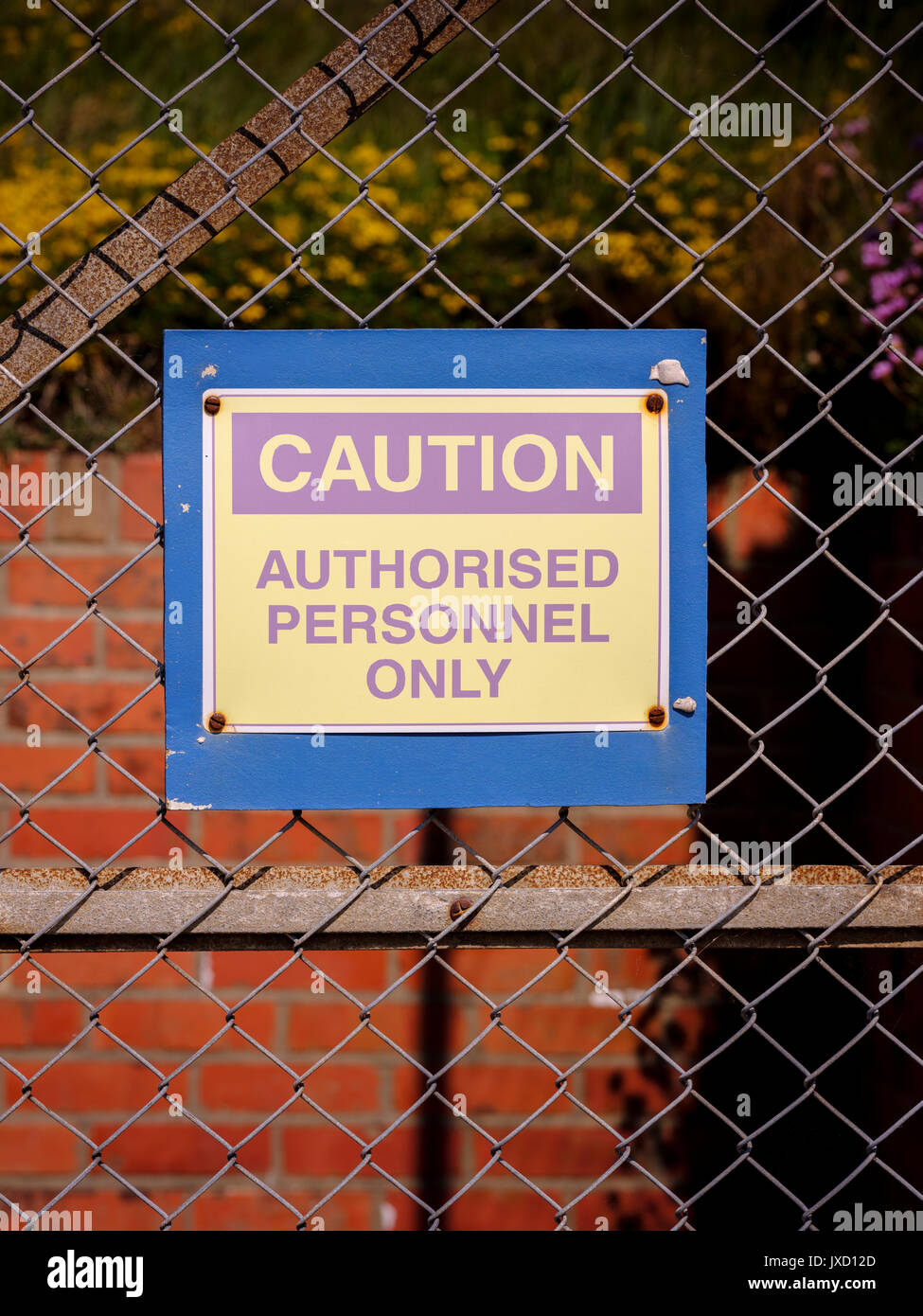 Caution Authorised personnel only - sign at the NCI Needles station coastguard on the Isle of WIght, South East UK. Stock Photo