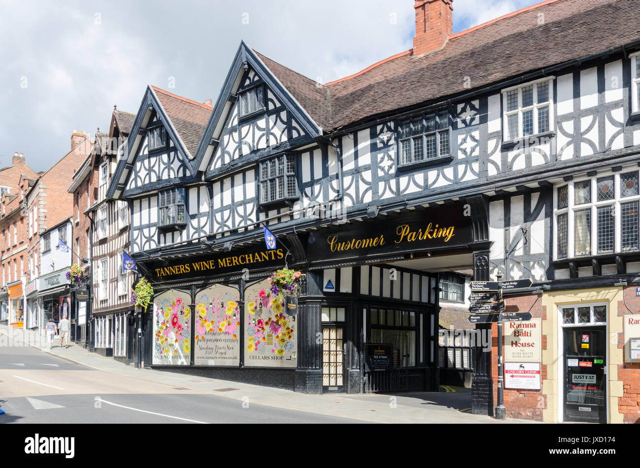 Shops and historic buildings lining Wyle Cop in Shrewsbury, Shropshire Stock Photo