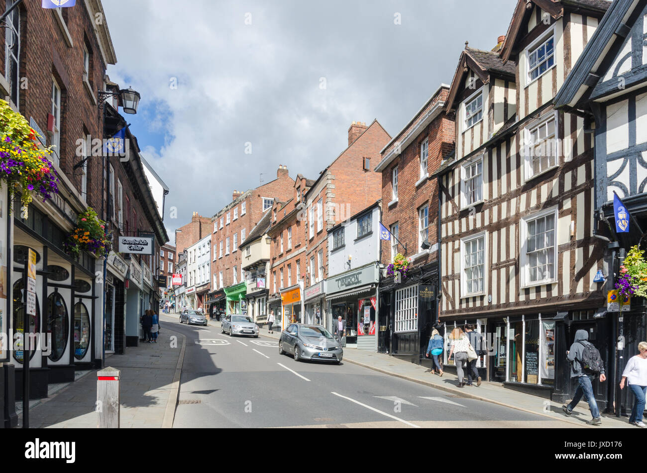 Shops and historic buildings lining Wyle Cop in Shrewsbury, Shropshire Stock Photo