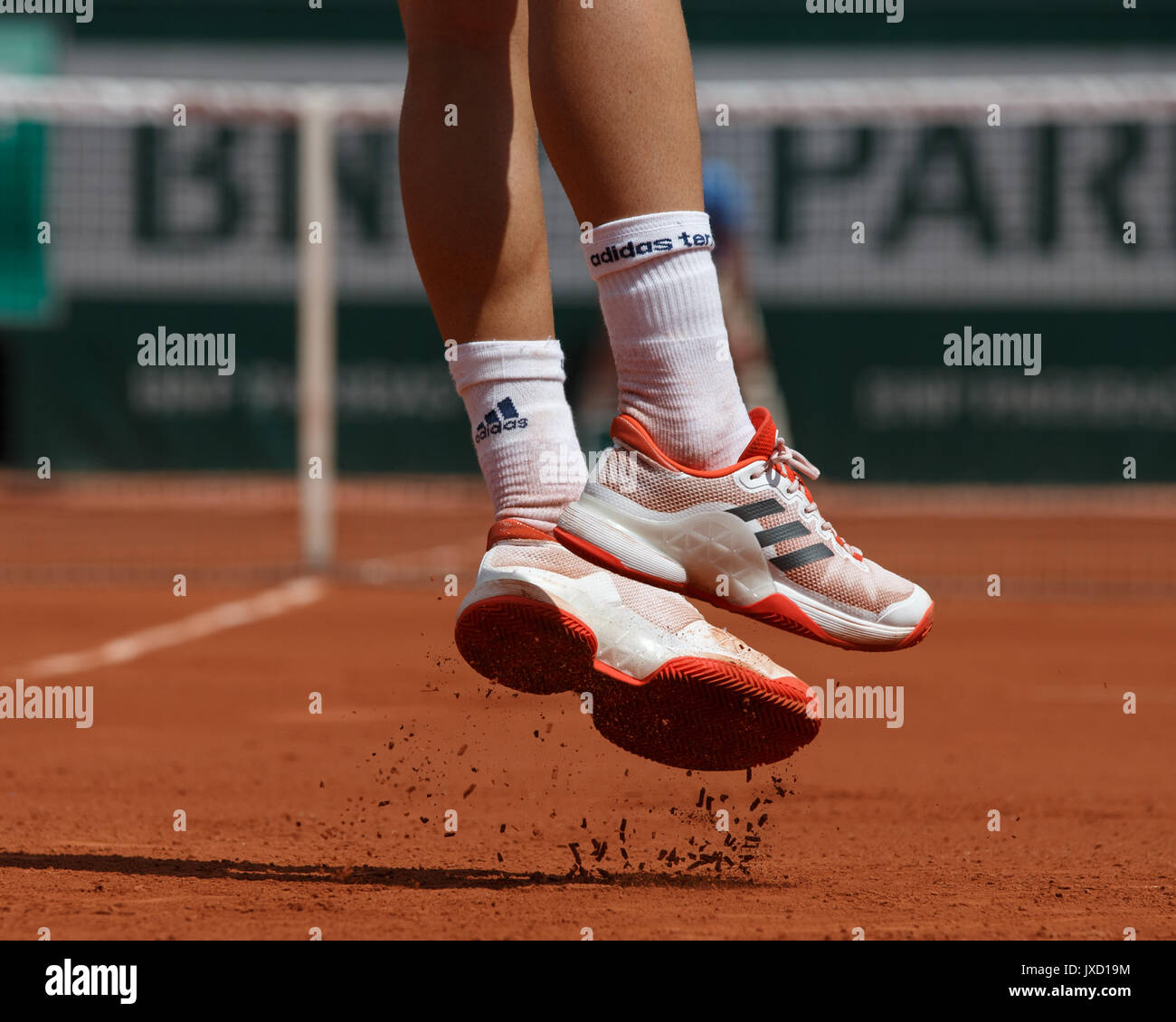 Feet of DOMINIC THIEM (AUT) lifting off the ground as he is serving at the  French Open Stock Photo - Alamy