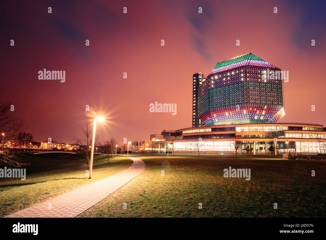 Minsk, Belarus - April 6, 2016: National Library Building In Evening LED Illumination On Blue Sky Background. Famous Hi-Tech Modern Landmark, Cultural Stock Photo