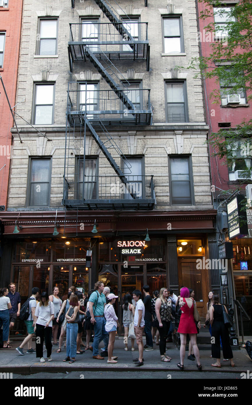 McDougal Street off washington Sq with restaurants in New York - USA Stock Photo