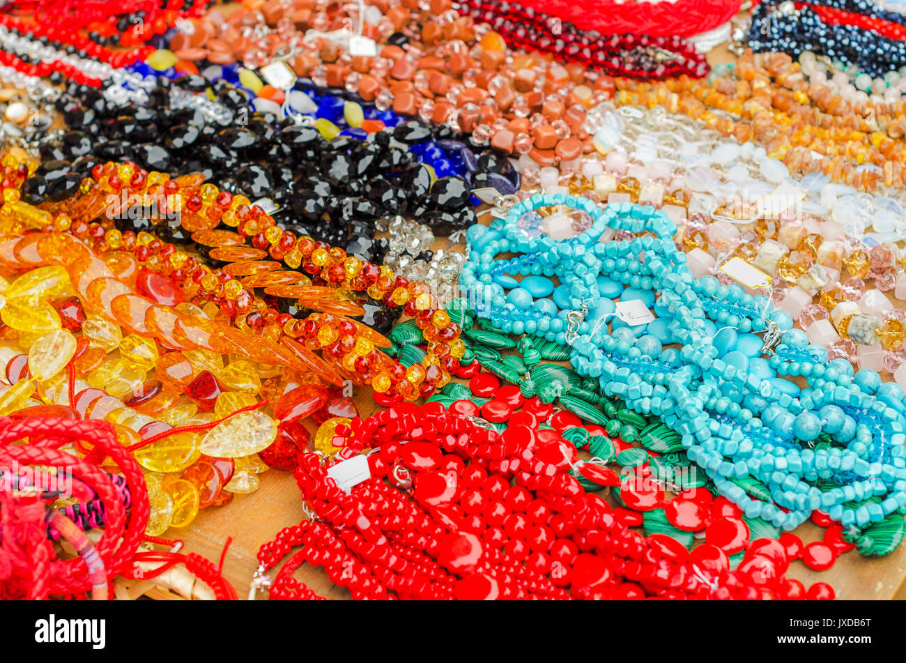 A pile of necklaces, bracelets and jewelry of assorted colors. Stock Photo