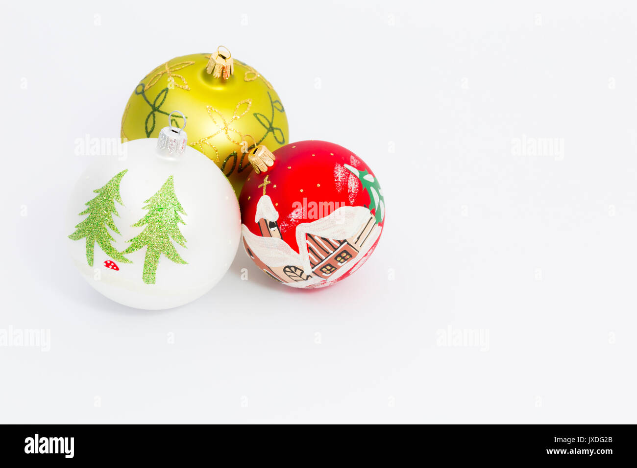 Beautiful white, red and green christmas balls on white background ...