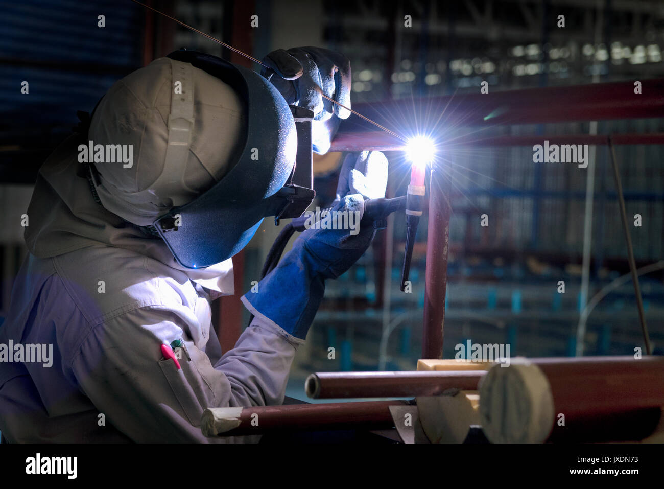 Welding steel pipe with MigMag method for industrial work. Gas metal