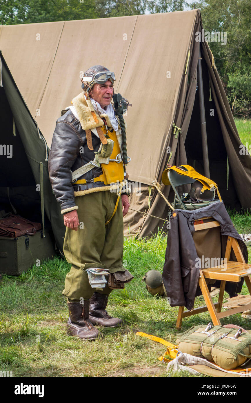 Re-enactor in World War Two military fighter pilot outfit posing in re-enactment camp during WW2 militaria fair Stock Photo