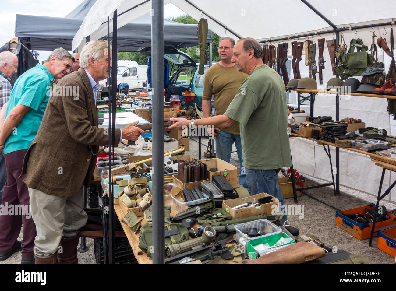 WW2 collector buying Second World War military memorabilia from stand at militaria fair Stock Photo