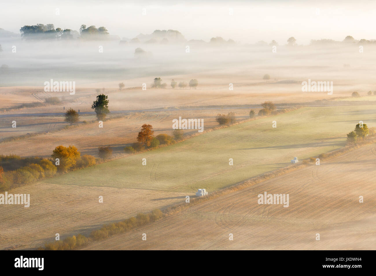 Morning fog over an agricultural landscape with autumn colors Stock ...