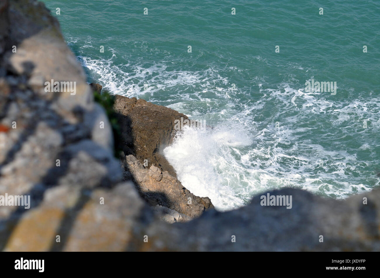 Sea waves hitting the rocks Stock Photo