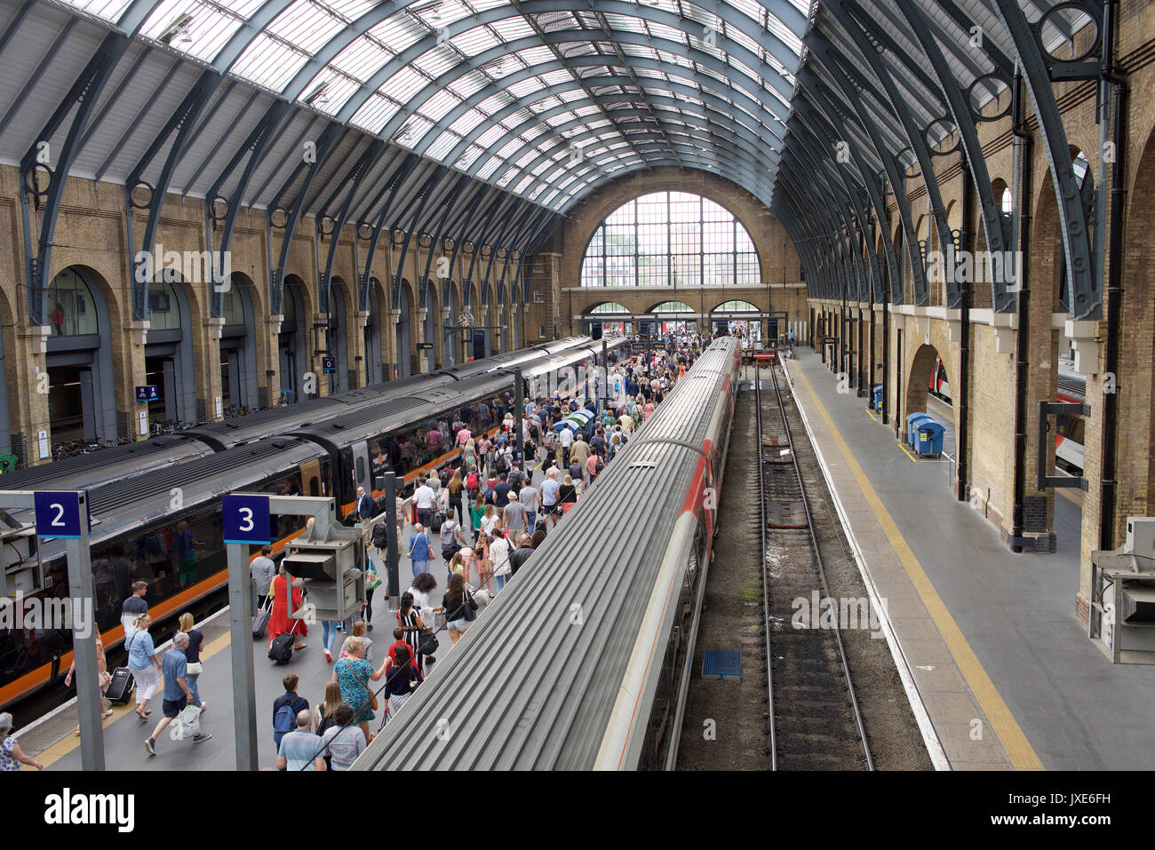 Passengers getting off a train at London Kings Cross railway station