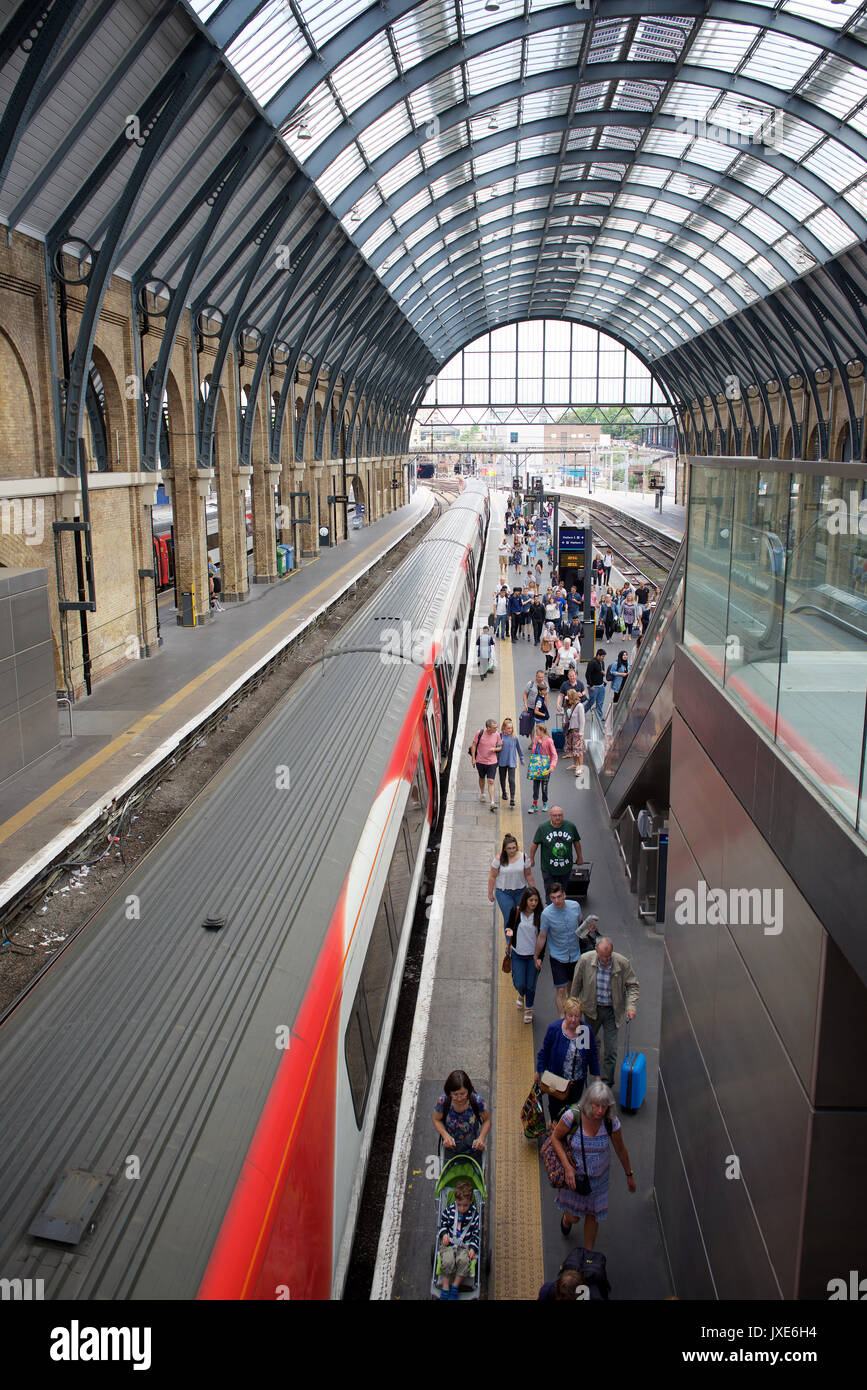 Passengers getting off a train at London Kings Cross railway station