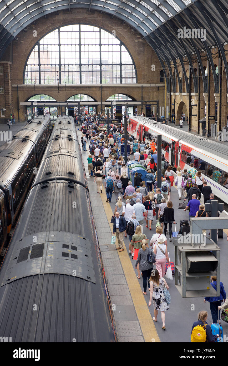 Passengers getting off a train at London Kings Cross railway station