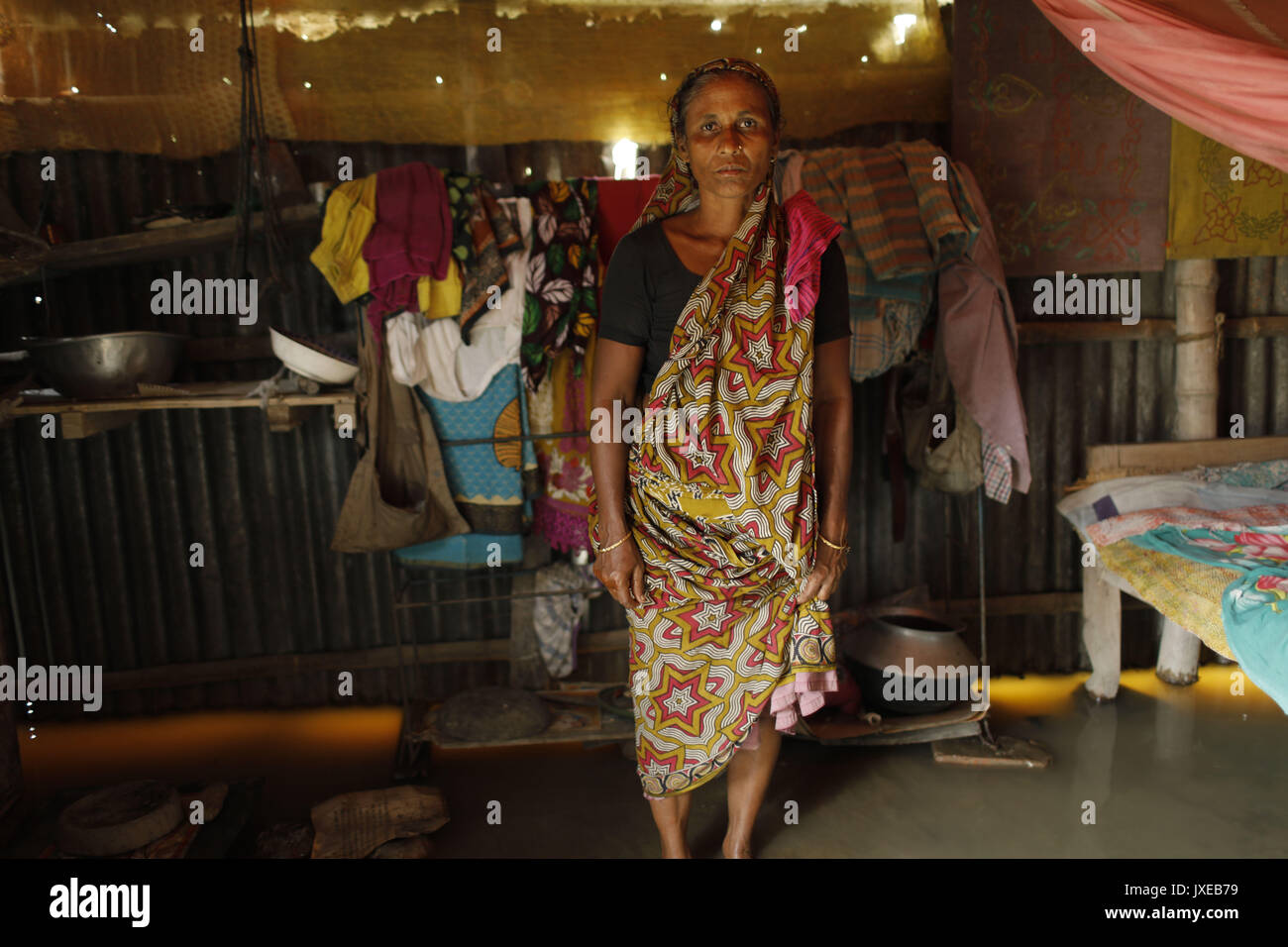 Dhaka, Bangladesh. 15th Aug, 2017. Jamila begum at her house when all area under the floodwater at Sariakandhi. Flood-related incidents in Dinajpur, Gaibandha and Lalmonirhat raising the death toll to 30 in the last three days across the country. Credit: K M Asad/ZUMA Wire/Alamy Live News Stock Photo