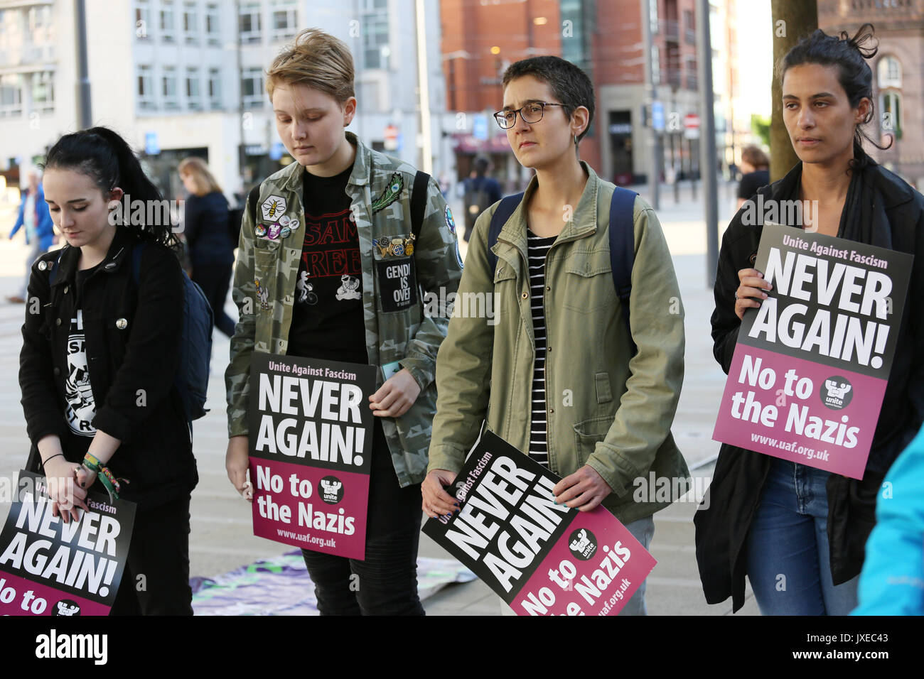 Manchester, UK. 15th Aug, 2017. 'Never Again no to the Nazis' placards held at vigil for Heather Heyer who was killed in Charlottesville after a car crashed into demonstrators protesting a white supremacy rally, St Peters Square, Manchester, 15th August, 2017 Credit: Barbara Cook/Alamy Live News Stock Photo