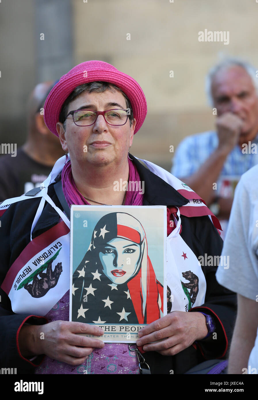 Manchester, UK. 15th Aug, 2017. An American woman joins a vigil for Heather Heyer who was killed in Charlottesville after a car crashed into demonstrators protesting a white supremacy rally, St Peters Square, Manchester, 15th August, 2017 Credit: Barbara Cook/Alamy Live News Stock Photo