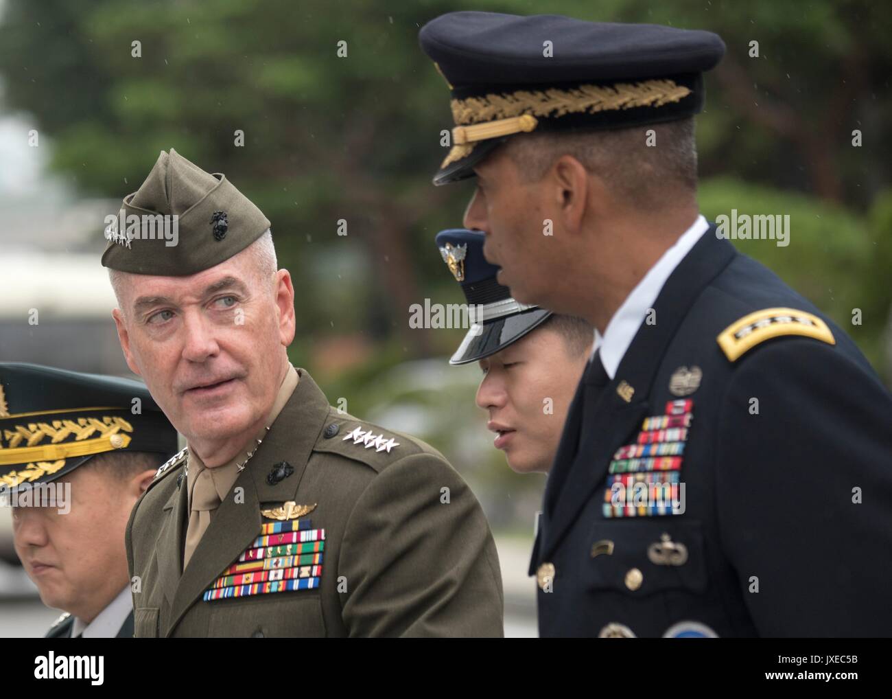 U.S. Chairman of the Joint Chiefs Gen. Joseph Dunford, left, walks with Army Gen. Vincent Brooks, commander, U.S. Forces Korea following a press conference outside Combined Forces Command August 14, 2017 in Seoul, South Korea. Dunford is meeting military leaders in the Asia-Pacific region as tensions rise with North Korea over nuclear and ballistic missiles tests. Stock Photo