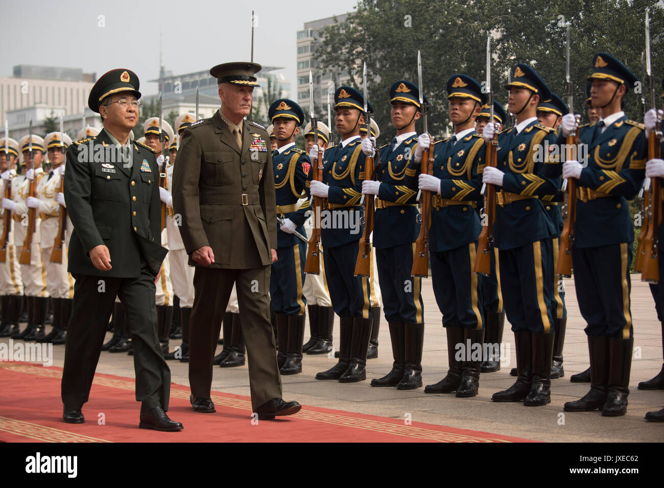 Beijing, China. 15th Aug, 2017. U.S. Chairman of the Joint Chiefs Gen. Joseph Dunford, right, reviews the honor guard during a red carpet arrival ceremony with his Chinese counterpart Chinese People's Liberation Army Gen. Fang Fenghui at the Bayi building August 15, 2017 in Beijing, China. Dunford and Fang signed an agreement to strengthen communication between the two militaries amid tensions concerning North Korea. Credit: Planetpix/Alamy Live News Stock Photo