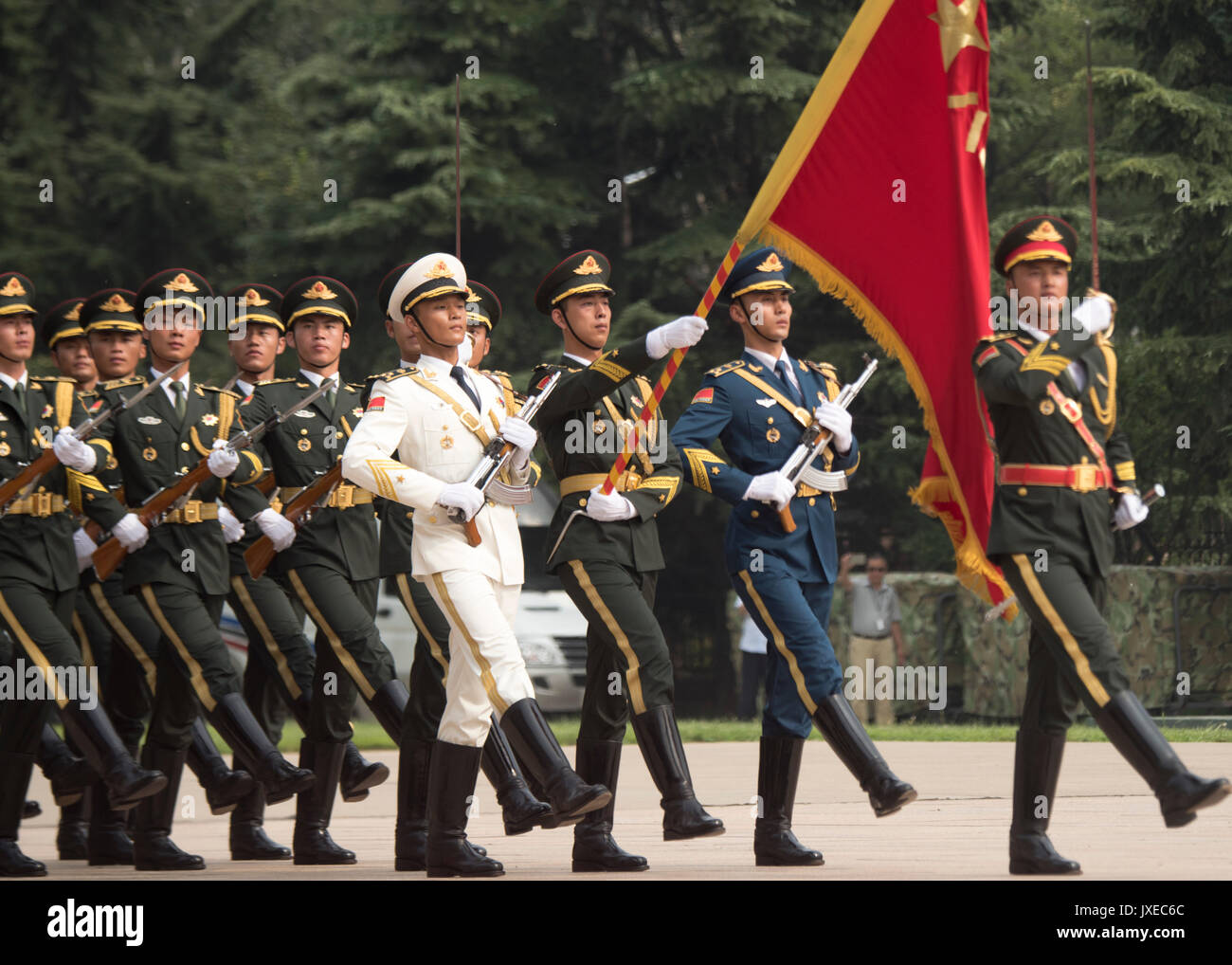 Beijing, China. 15th Aug, 2017. Chinese People's Liberation Army honor guard parade during a red carpet arrival ceremony for U.S. Chairman of the Joint Chiefs Gen. Joseph Dunford at the Bayi building August 15, 2017 in Beijing, China. Dunford is in Beijing to strengthen communication between the two militaries amid tensions concerning North Korea. Credit: Planetpix/Alamy Live News Stock Photo