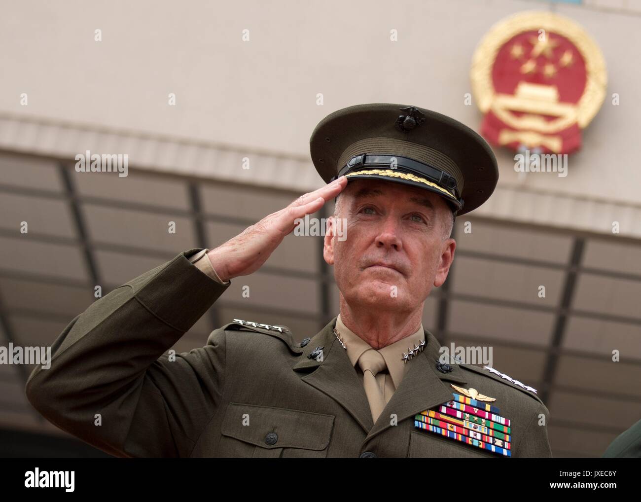 Beijing, China. 15th Aug, 2017. U.S. Chairman of the Joint Chiefs Gen. Joseph Dunford salutes during a red carpet arrival ceremony at the Bayi building August 15, 2017 in Beijing, China. Dunford and Fang signed an agreement to strengthen communication between the two militaries amid tensions concerning North Korea. Credit: Planetpix/Alamy Live News Stock Photo