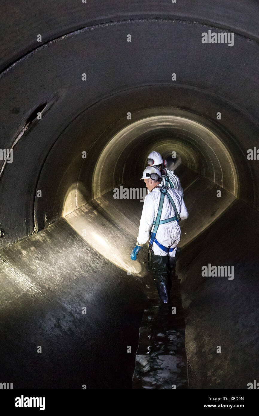 Schweinfurt, Germany. 17th July, 2017. Sewage workers can be seen in the underground sewage during an inspeaction walk in Schweinfurt, Germany, 17 July 2017. Unnoticed by many people sewage workers take care that cities do not turn into stinking cesspools. A great amount of the daytime they, therefore, spend in the underground. Photo: Daniel Karmann/dpa/Alamy Live News Stock Photo