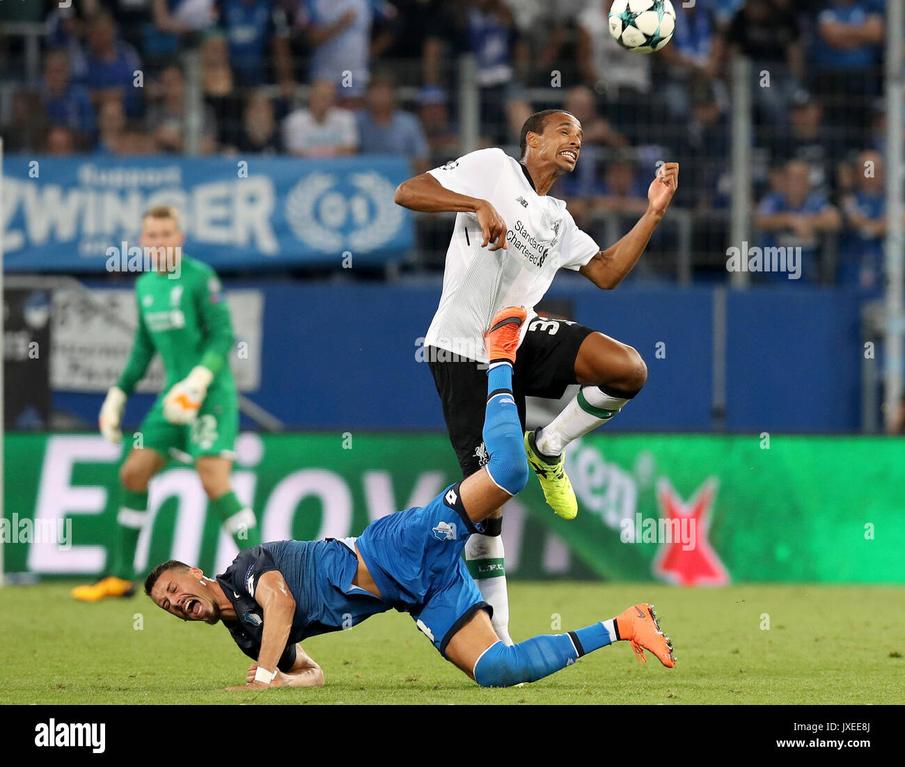 Sinheim, Germany. 15th Aug, 2017. Joel Matip (R) of Liverpool and Sandro Wagner of 1899 Hoffenheim compete during the UEFA Champions League Qualifying Play-Offs Round First Leg match at Wirsol Rhein-Neckar-Arena in Sinsheim, Germany, on August 15, 2017. Liverpool won 2-1. Credit: Joachim Bywaletz/Xinhua/Alamy Live News Stock Photo