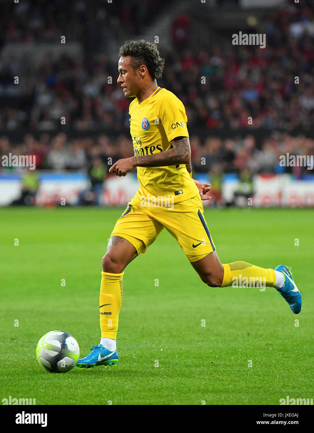 Paris Saint-Germain's Brazilian forward Neymar runs during the French L1 football match Paris Saint-Germain (PSG) vs En Avant Guingamp (EAG) at the Roudourou stadium in Guingamp on August 13, 2017. Stock Photo