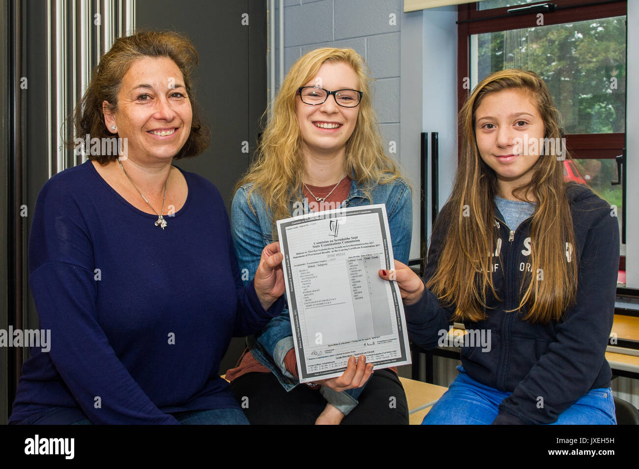 Schull, Ireland. 16th Aug, 2017. Leaving Cert student Jesse Wells from Schull is pictured with her mum Helen and sister Molly after receiving her Leaving Cert results at Schull Community College.  Jesse is going to London UAL to study Interaction Design Arts. Credit: Andy Gibson/Alamy Live News. Stock Photo