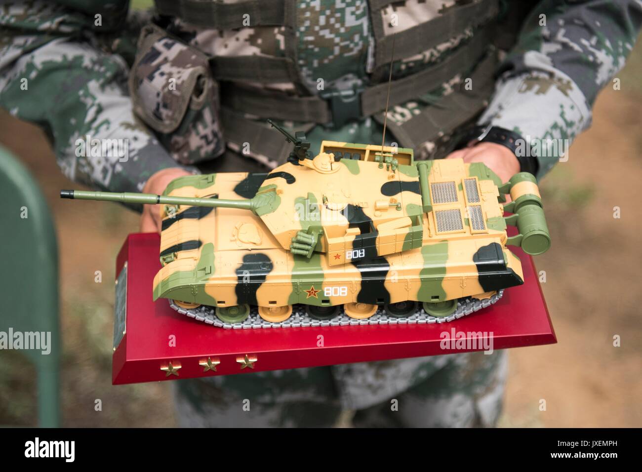 Haichung, China. 16th Aug, 2017. A Chinese PLA soldier presents a model of the ZTZ99 main battle tank to U.S. Chairman of the Joint Chiefs Gen. Joseph Dunford at the Chinese Northern Theater Command Army Force Haichung Camp August 16, 2017 in Haichung, China. Dunford told Chinese leaders that the U.S. hoped diplomatic and economic pressure would convince North Korea to end its nuclear program, but that it was also preparing military options. Credit: Planetpix/Alamy Live News Stock Photo