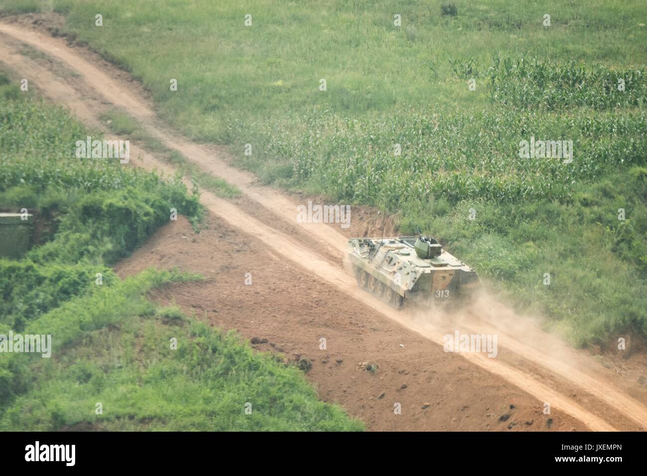 Haichung, China. 16th Aug, 2017. People's Liberation Army soldiers maneuver in an armored personal carrier during an attack exercise at the Chinese Northern Theater Command Army Force Haichung Camp August 16, 2017 in Haichung, China. The exercise was for visiting U.S. Chairman of the Joint Chiefs Gen. Joseph Dunford. Credit: Planetpix/Alamy Live News Stock Photo