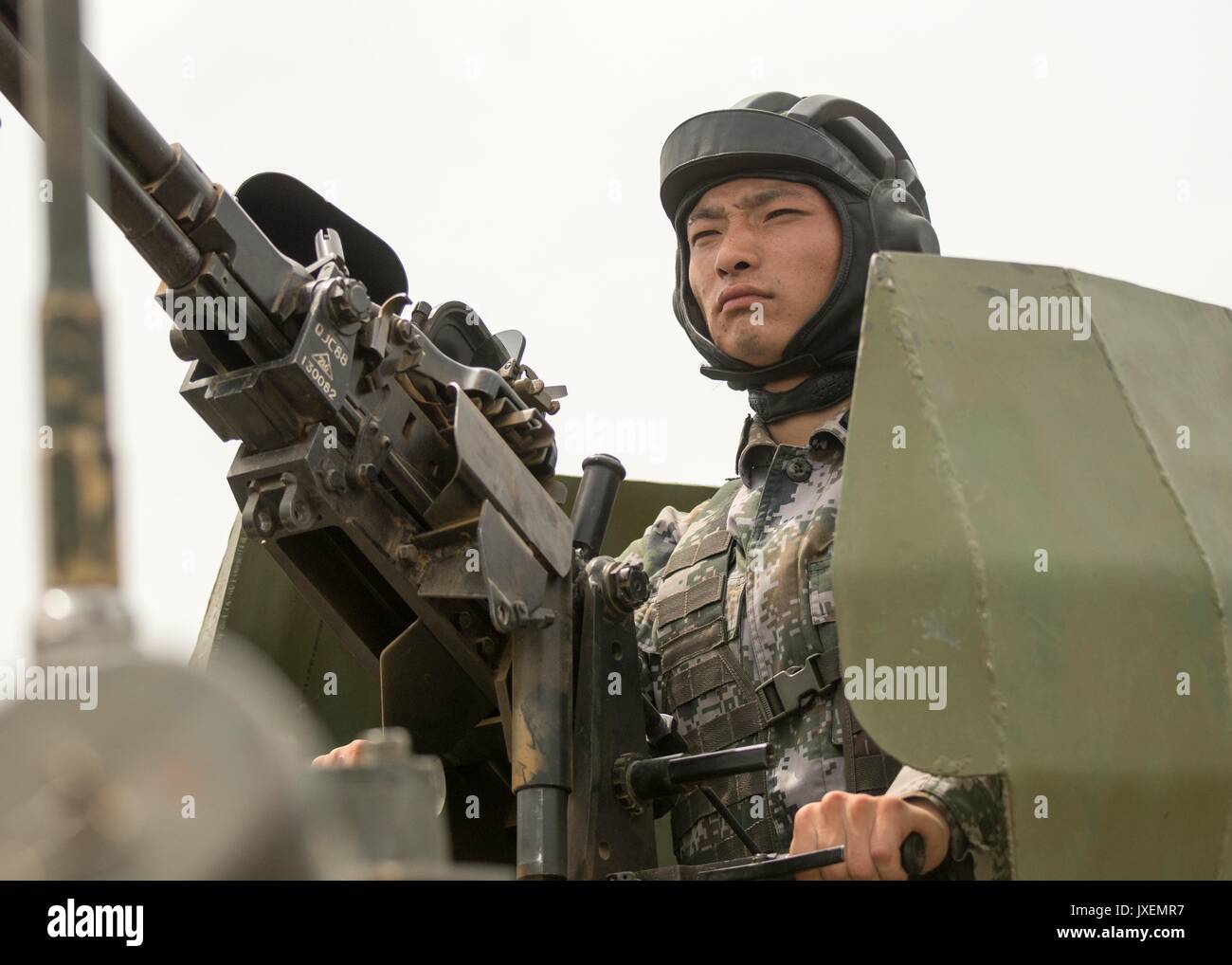 Haichung, China. 16th Aug, 2017. A Chinese People's Liberation Army soldier mans a heavy machine gun on a WZ531 armored personal carrier during an attack exercise at the Chinese Northern Theater Command Army Force Haichung Camp August 16, 2017 in Haichung, China. The exercise was for visiting U.S. Chairman of the Joint Chiefs Gen. Joseph Dunford. Credit: Planetpix/Alamy Live News Stock Photo