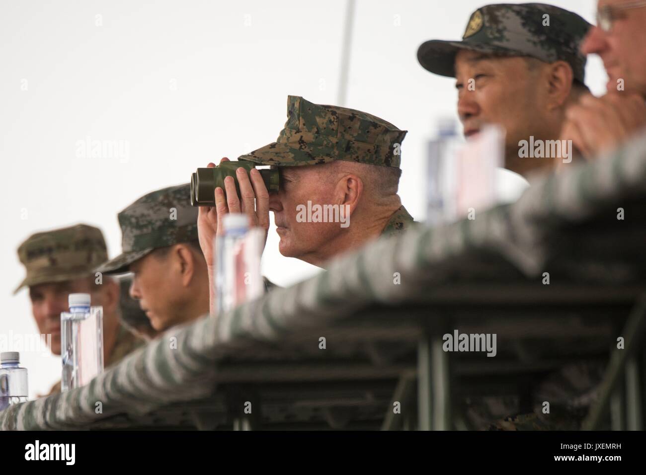 Haichung, China. 16th Aug, 2017. U.S. Chairman of the Joint Chiefs Gen. Joseph Dunford observes People's Liberation Army soldiers during an attack exercise at the Chinese Northern Theater Command Army Force Haichung Camp August 16, 2017 in Haichung, China. Dunford told Chinese leaders that the U.S. hoped diplomatic and economic pressure would convince North Korea to end its nuclear program, but that it was also preparing military options. Credit: Planetpix/Alamy Live News Stock Photo