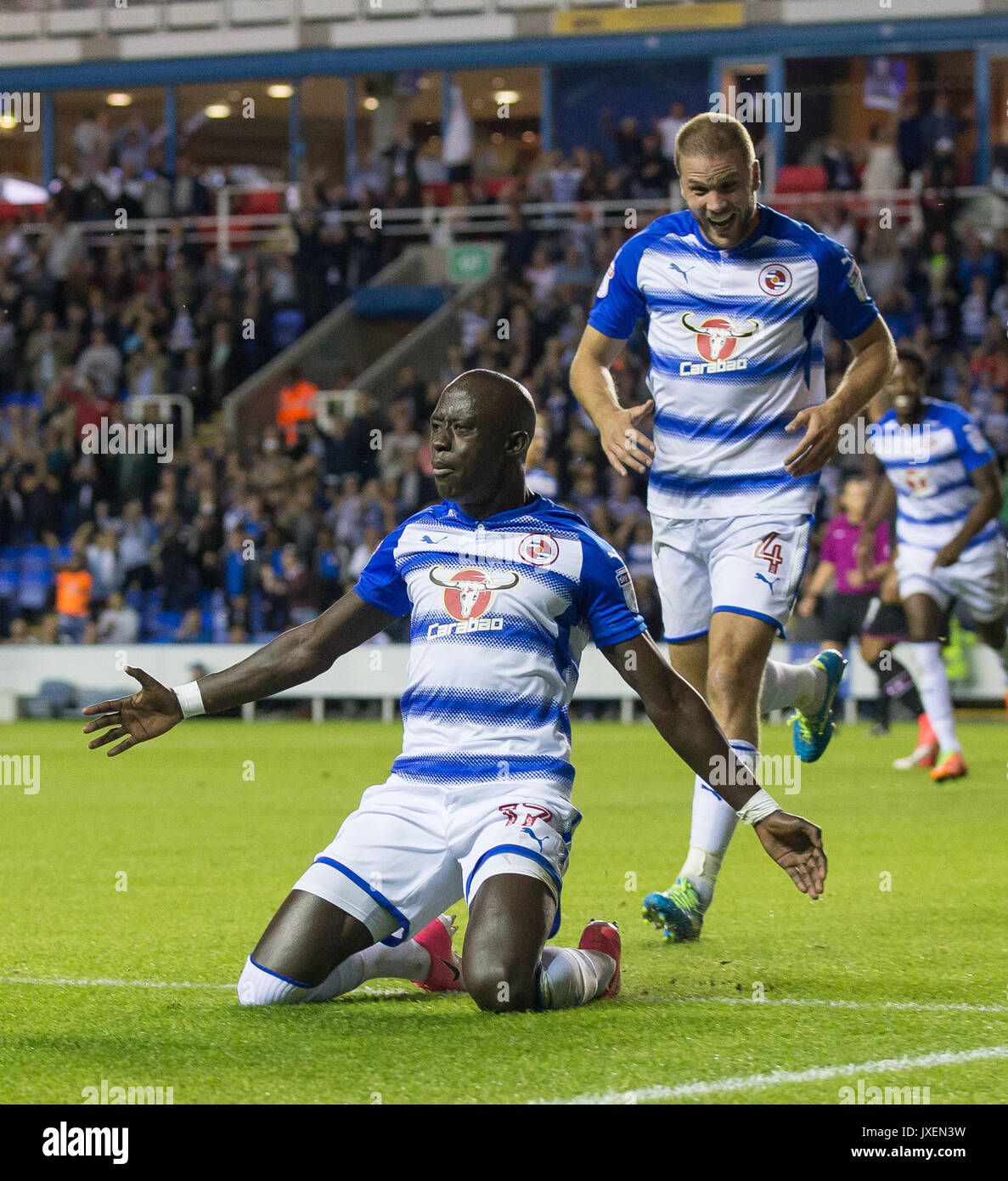 Reading, UK. 15th Aug, 2017. Modou Barrow of Reading slides on his knees to celebrate scoring his first goal for the club making it 2 0 during the Sky Bet Championship match between Reading and Aston Villa at the Madejski Stadium, Reading, England on 15 August 2017. Photo by Andy Rowland/PRiME Media Images. **EDITORIAL USE ONLY FA Premier League and Football League are subject to DataCo Licence. Credit: Andrew Rowland/Alamy Live News Stock Photo