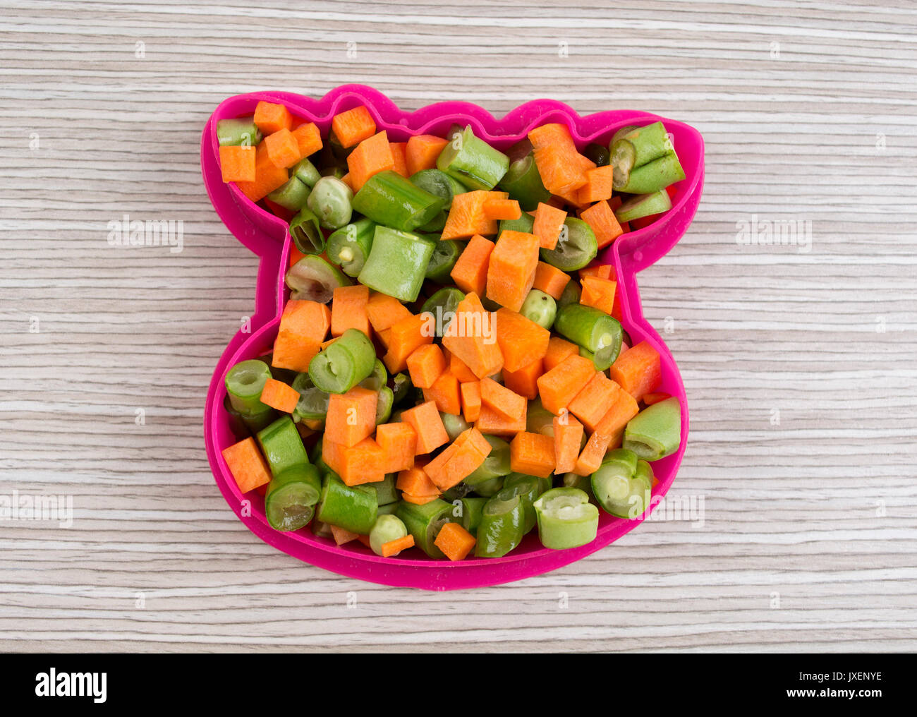 Cow shape by various vegetables on the table. Stock Photo