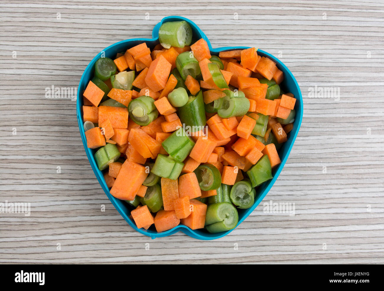 Apple shape by various vegetables on the table. Stock Photo