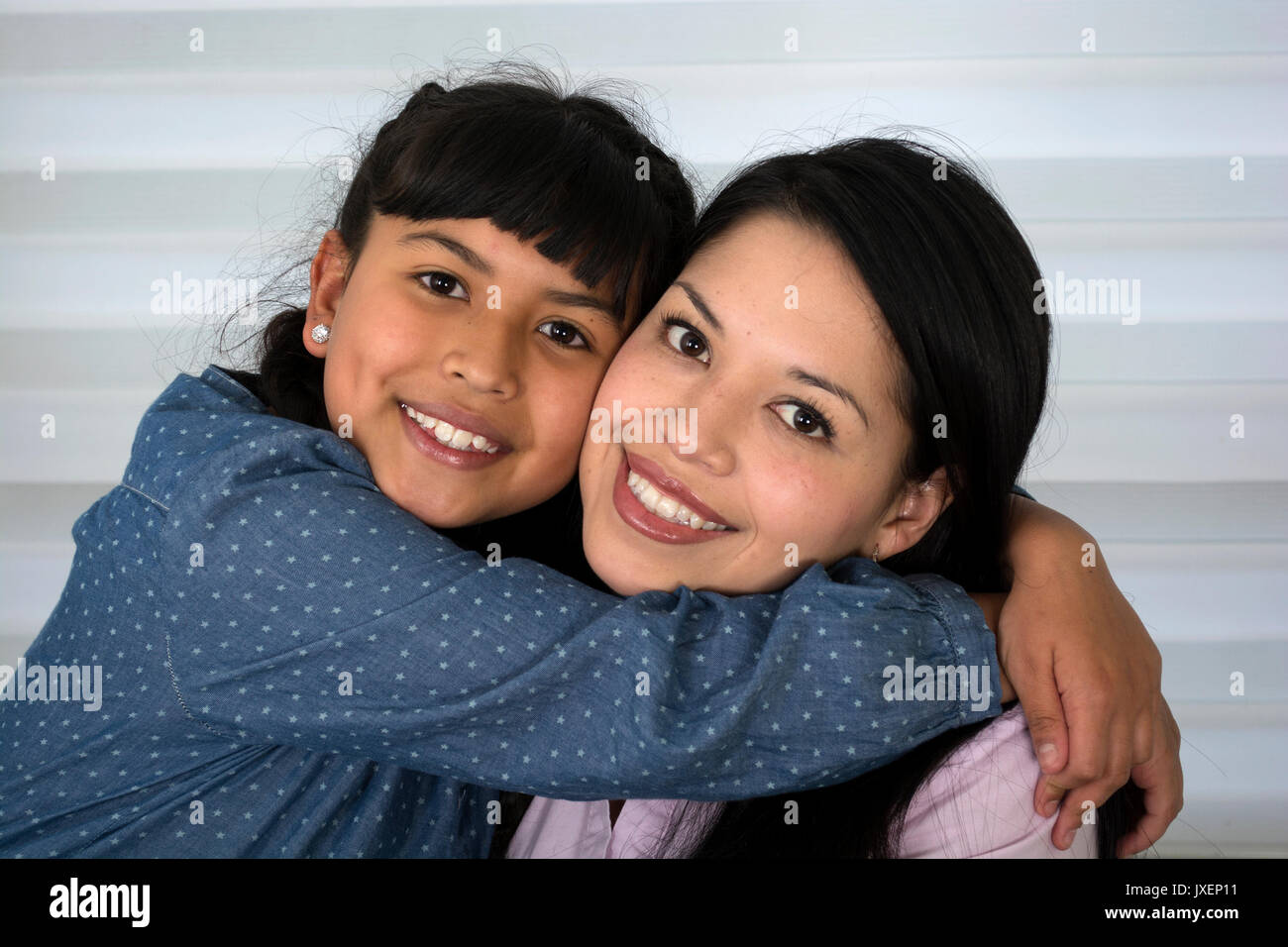 Happy mother and daughter laughing. Stock Photo