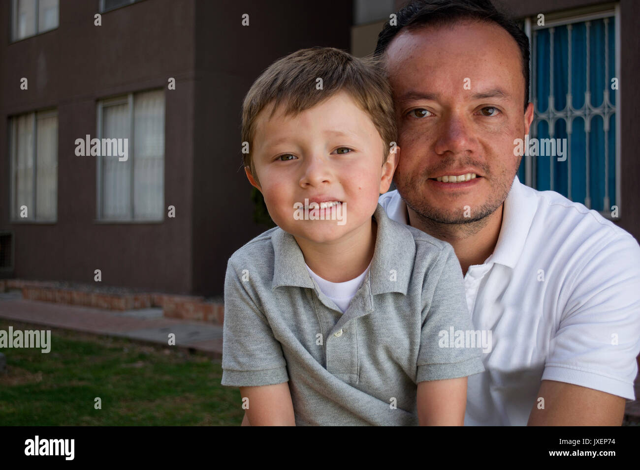 Happy Latin American man and boy, father and son. Stock Photo