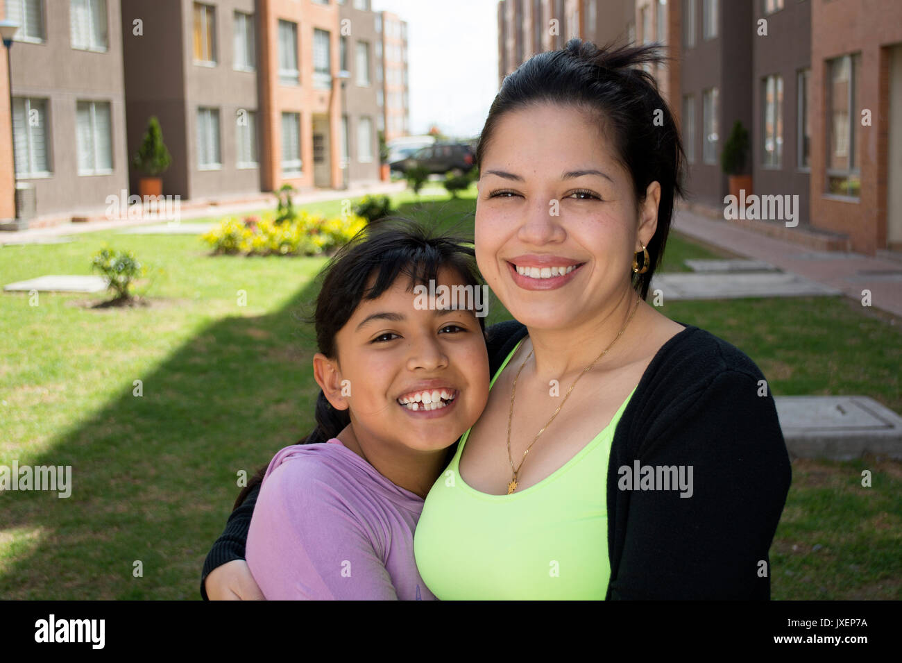 Happy mother and daughter laughing outdoor. Stock Photo