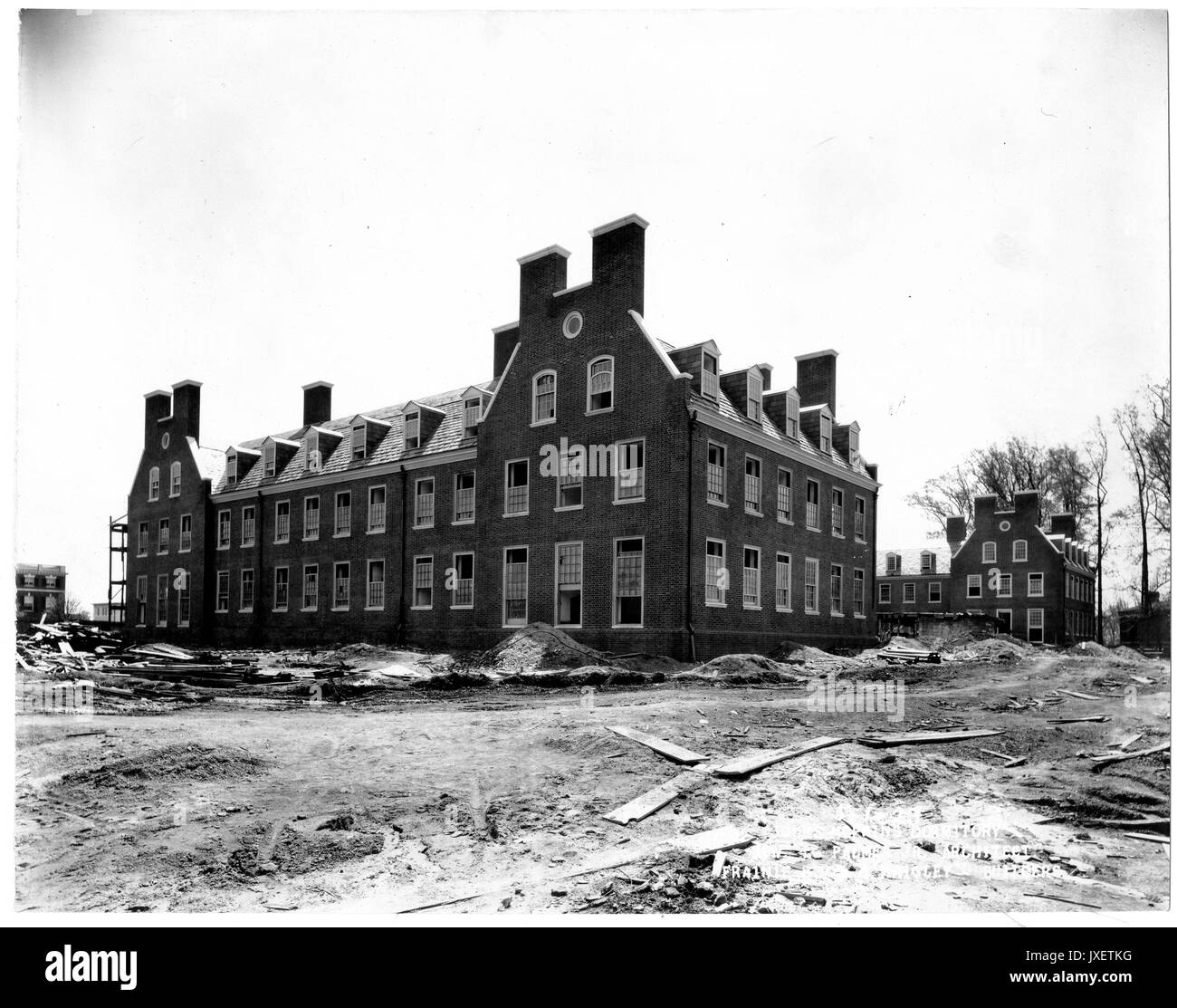 Alumni Memorial Residences AMR looking southeast, Exterior close to completion, Piles of dirt, rubble surround the building, 1923. Stock Photo