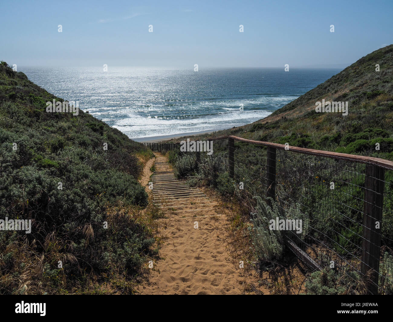Walking through the dunes with amazing view of the ocean Stock Photo