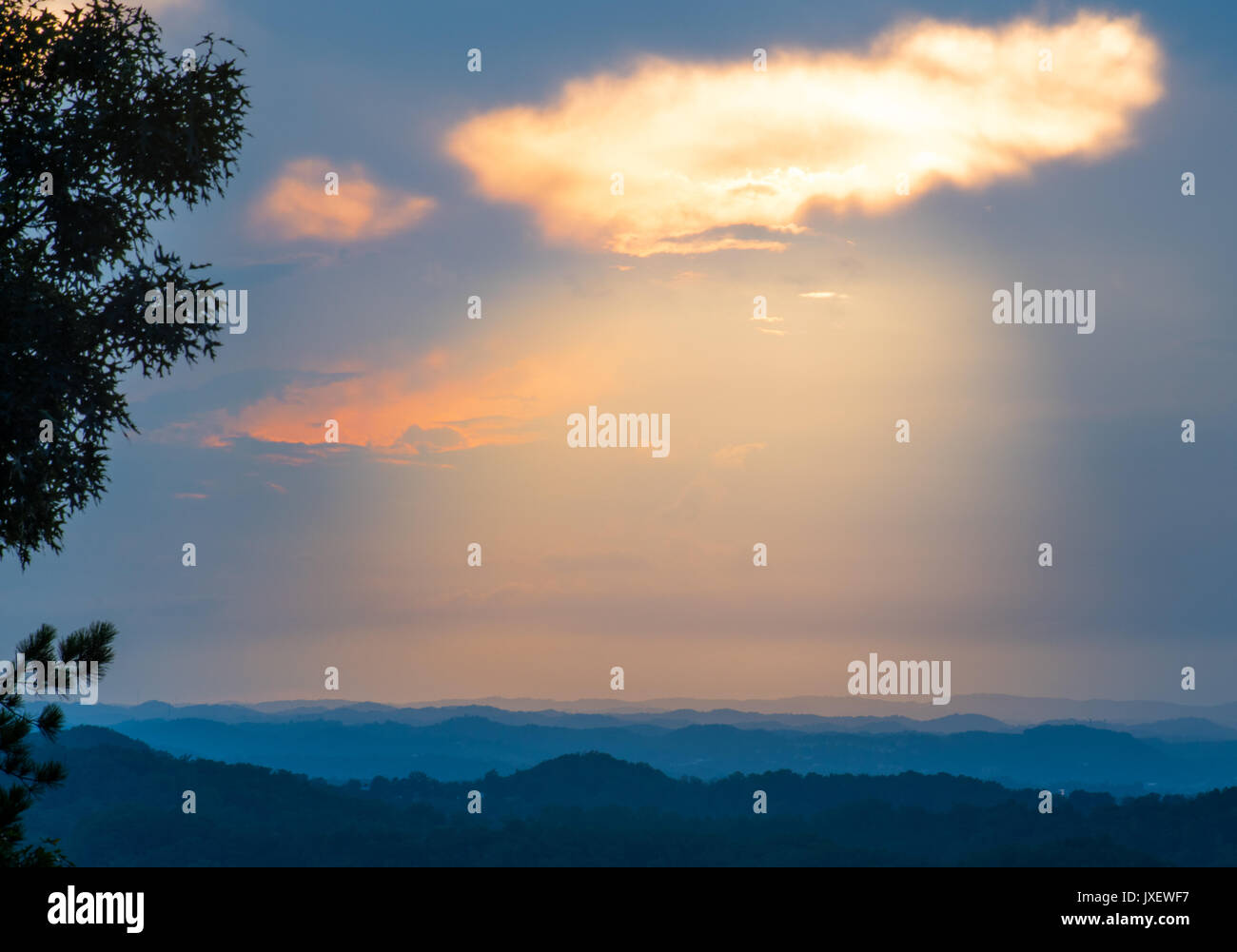 Sunset shining through a gap in the clouds over Pigeon Tennessee