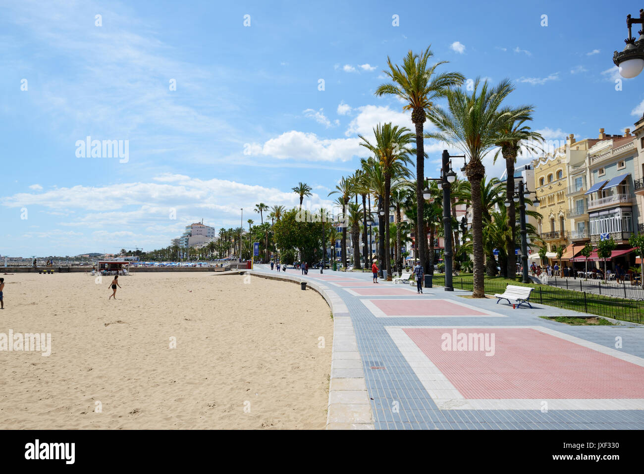 SITGES, SPAIN - MAY 23: The tourists enjoiying their vacation at seafront on May 23, 2015 in Sitges, Spain. Up to 60 mln tourists is expected to visit Stock Photo