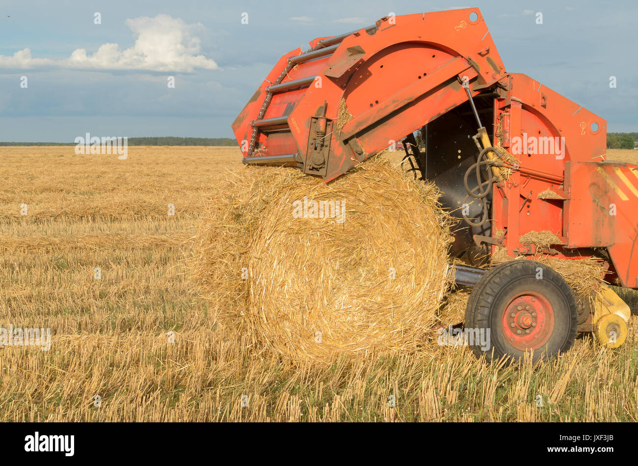 Special machines for harvesting form round bales of hay Stock Photo