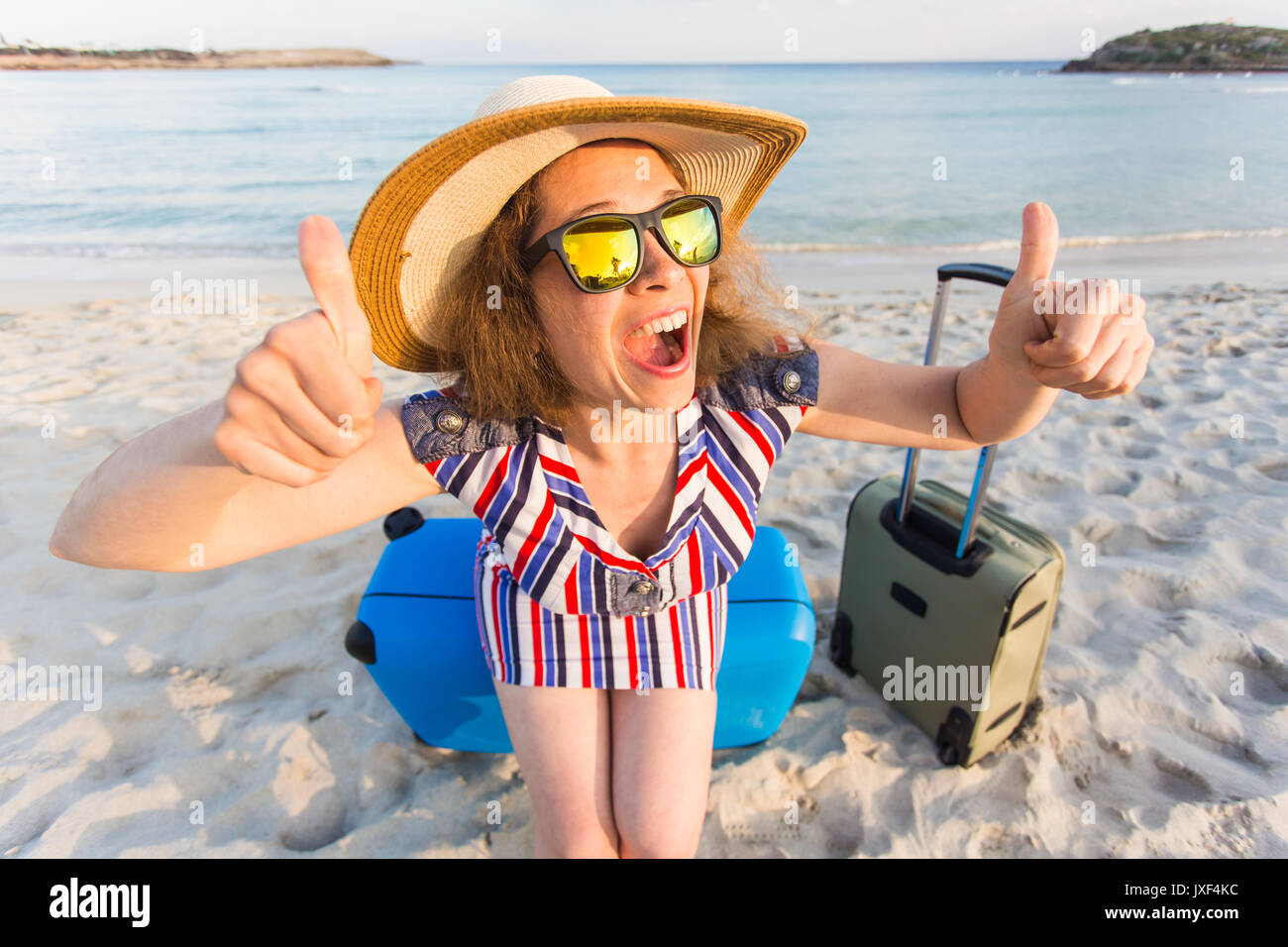 Happy Traveler Woman With Suitcase Showing Thumbs Up Gesture Concept