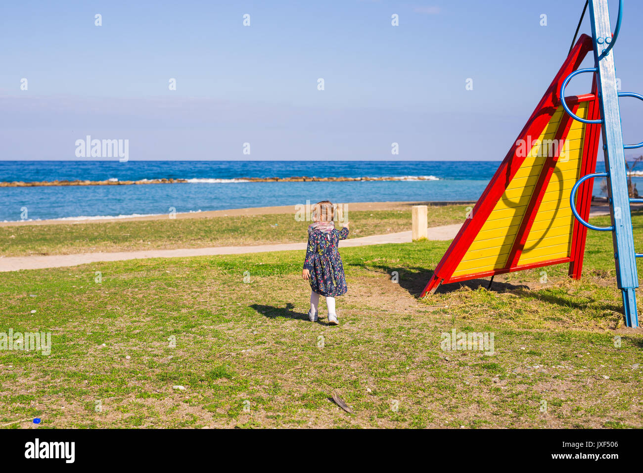 Portrait of beautiful young girl on the playground Stock Photo - Alamy
