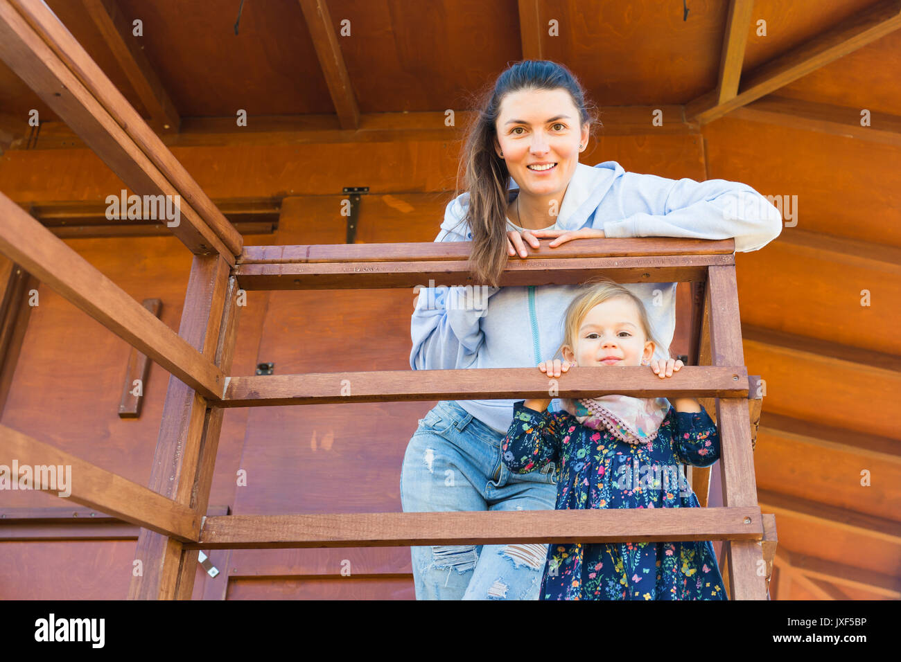 Mother with her cute little girl in a park Stock Photo - Alamy
